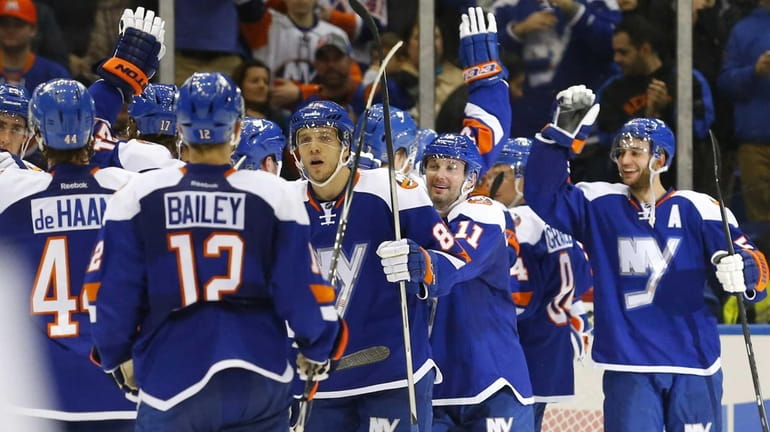 The New York Islanders celebrates after defeating the Tampa Bay...