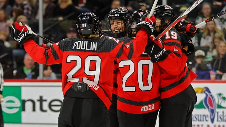 Canada players celebrates after a goal by Natalie Spooner (24)...
