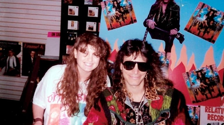 Michele Rizzo-Berg with guitarist Steve Vai at Roosevelt Field Mall...