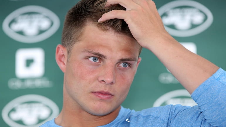 Jets quarterback Zach Wilson talks to the media during training camp at...