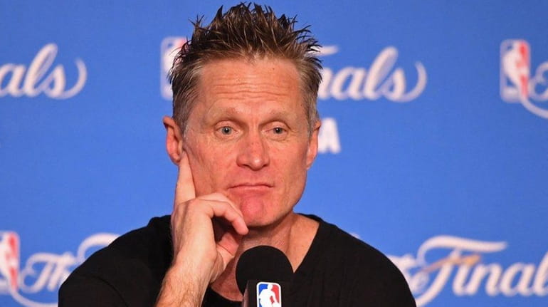 Steve Kerr speaks at the press conference after his of...