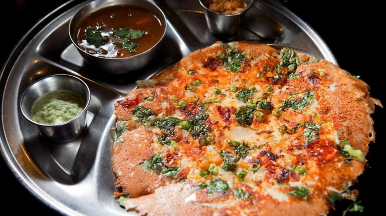 Mixed vegetable uttapam is served at House of Dosas, a...