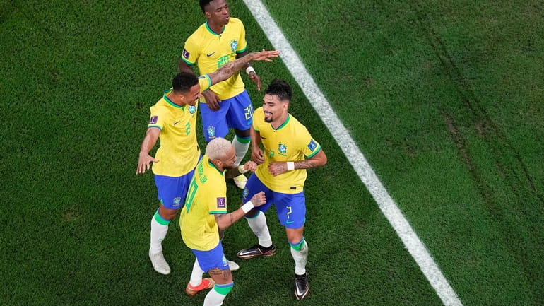 Brazil's Vinicius Junior, Danilo and Neymar dance with Lucas Paqueta,...
