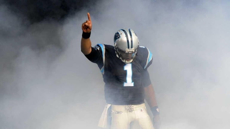 Carolina Panthers' Cam Newton gestures as he is introduced before...