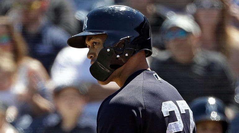 Yankees' Giancarlo Stanton glares at Pirates reliever Brett McKinney after...