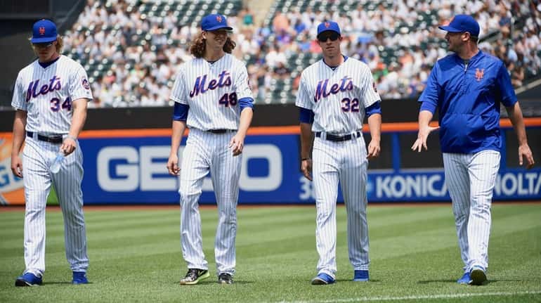 New York Mets pitchers Noah Syndergaard, Jacob deGrom, Steven Matz...