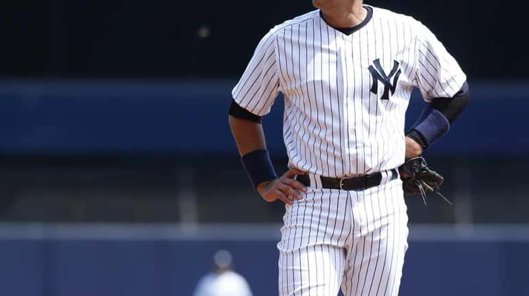 Alex Rodriguez stands at third during the first game of...