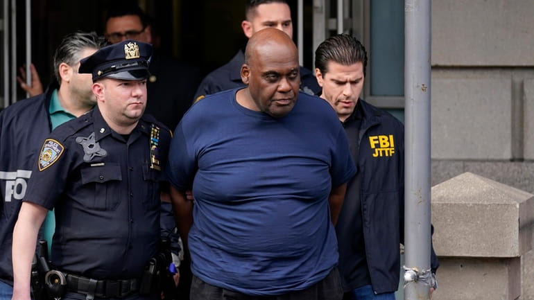Authorities lead subway shooting suspect Frank James from a Manhattan police station on April...