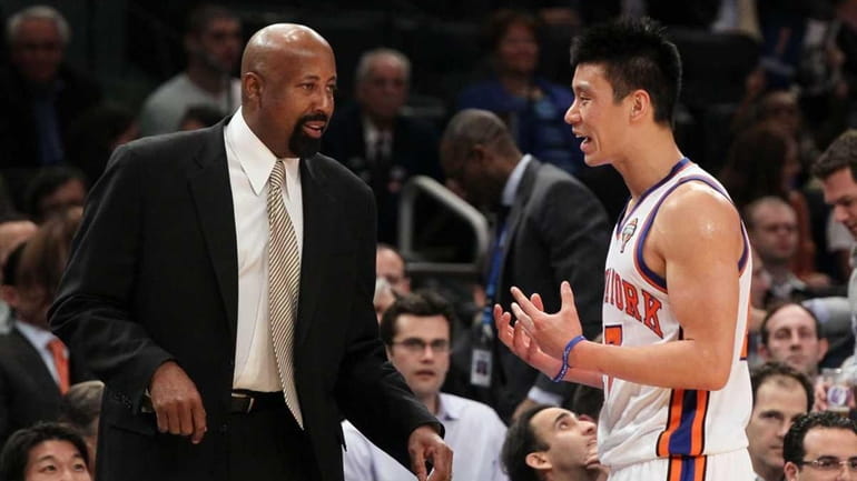 Interim head coach Mike Woodson and Jeremy Lin #17 of...