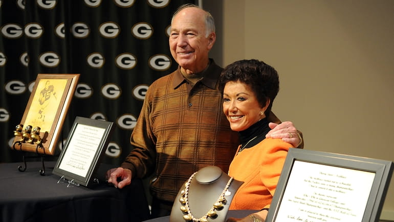 Former Green Bay Packers quarterback Bart Starr, left, and his...