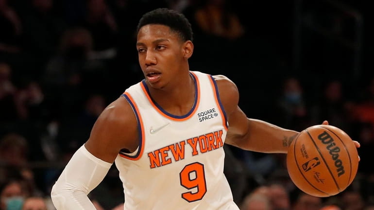 RJ Barrett of the Knicks controls the ball in the...