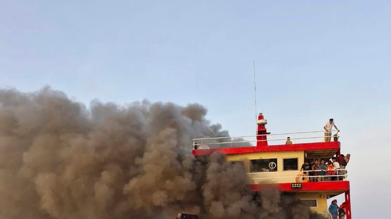 Smoke rises from a ferry in Surat Thani province, Thailand,...