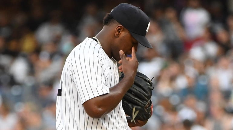 Yankees starting pitcher Luis Severino stands on the mound as...
