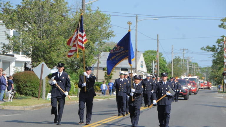 Riverhead’s Fire Department marches in the Memorial Day parade on Monday.
