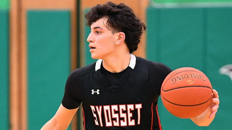 AJ AbuSaab of Syosset looks to pass during a Nassau boys...