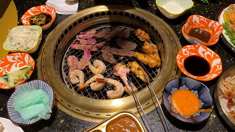 Wuyang Casa Japanese BBQ in Lake Grove has installed golden barbecue...