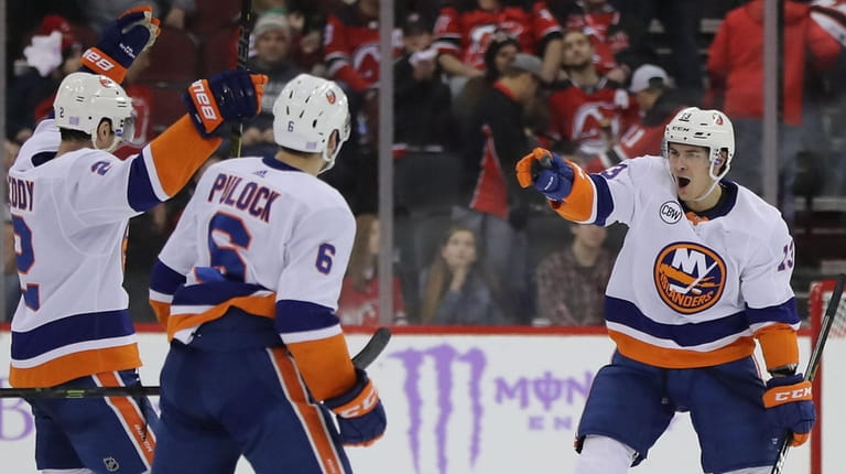 The Islanders' Mathew Barzal  celebrates his game-winning goal in overtime...