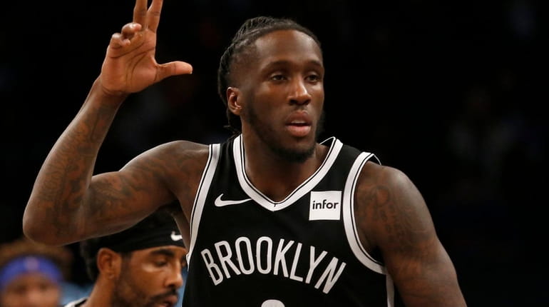 Taurean Prince of the Nets reacts after a three-point basket against the Knicks...