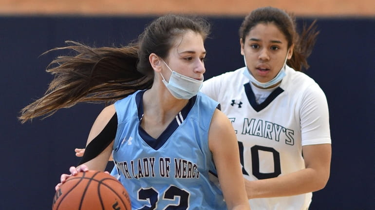 Hailey Clancy #22 of Our Lady of Mercy Academy, left,...