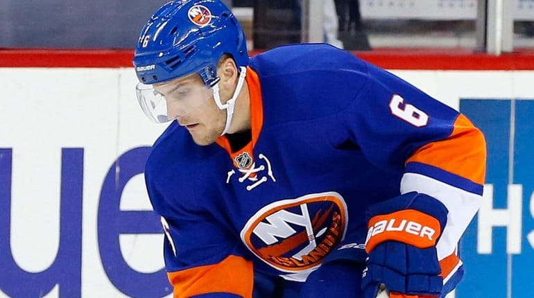 Ryan Pulock #6 of the New York Islanders plays the...
