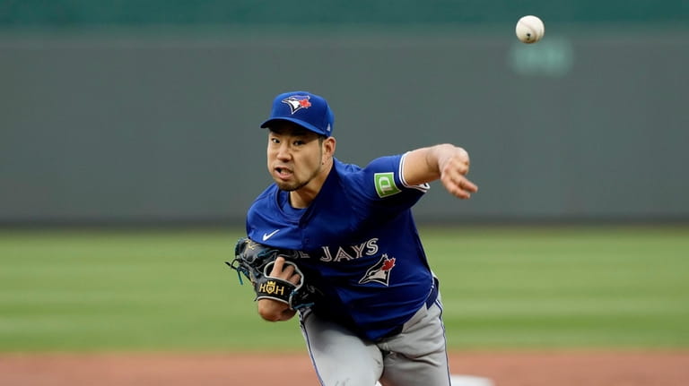 Toronto Blue Jays starting pitcher Yusei Kikuchi throws during the...