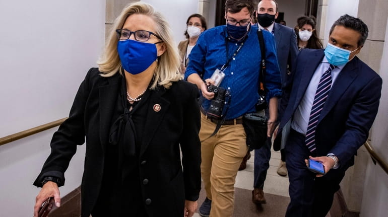 Rep. Liz Cheney (R-Wyo.) heads to the House floor to...
