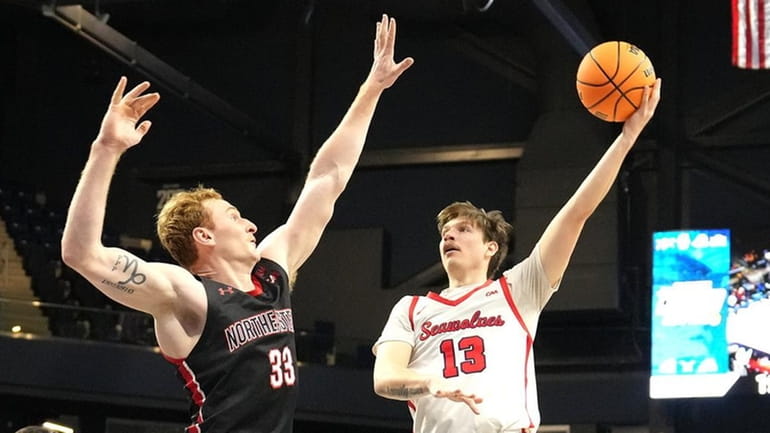 Dean Noll of the Stony Brook Seawolves takes a shot...
