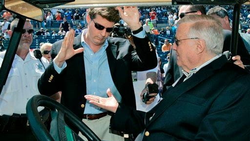 New York Yankees principal owner George Steinbrenner, right, slaps hands...