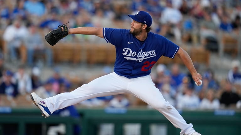 Los Angeles Dodgers starting pitcher Clayton Kershaw (22) throws during...