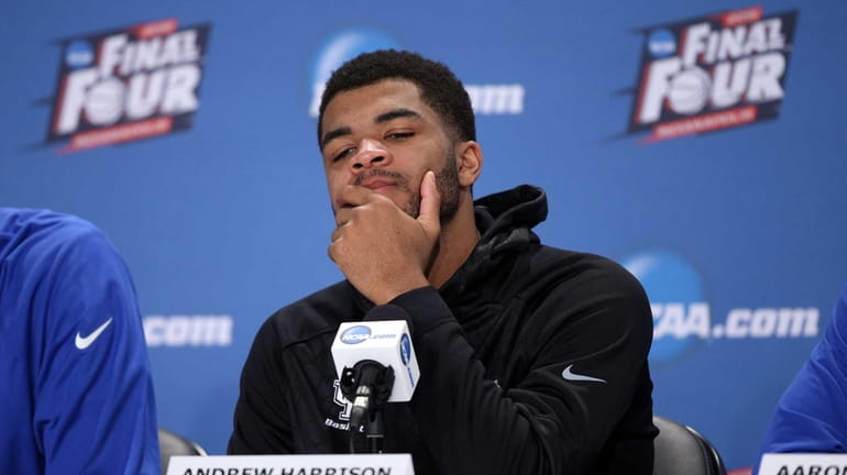 Andrew Harrison of the Kentucky Wildcats reacts in the post...