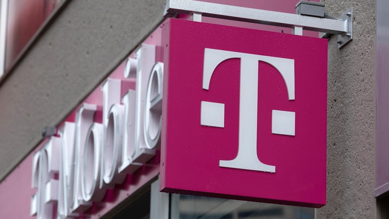 The T-Mobile logo is seen on a storefront, Oct. 14,...