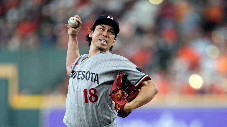 Minnesota Twins relief pitcher Kenta Maeda throws during the fourth...