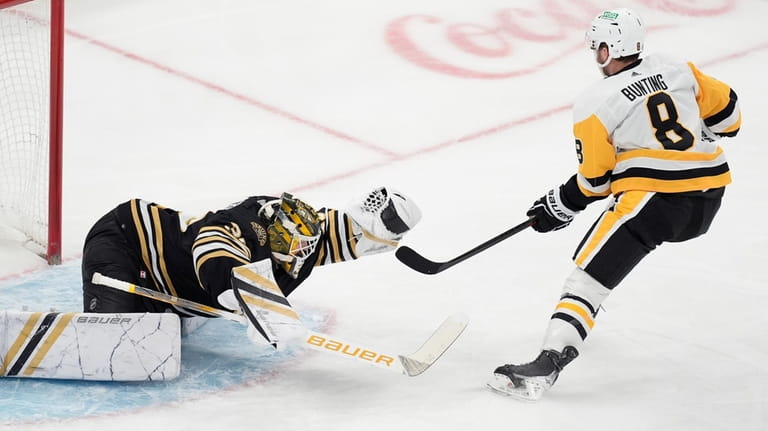 Boston Bruins' Linus Ullmark (35) makes a glove save on...