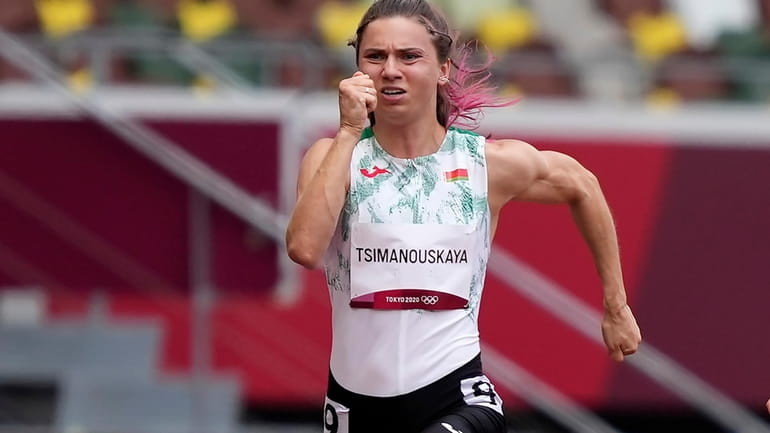 Krystsina Tsimanouskaya, of Belarus, runs in the women's 100-meter run...