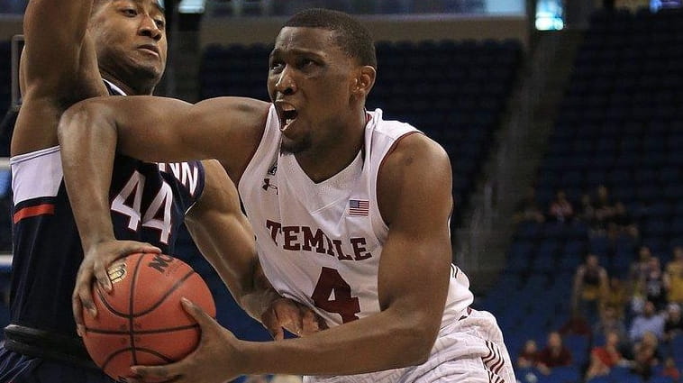 Daniel Dingle of the Temple Owls drives on Rodney Purvis...