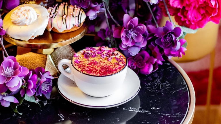 The East Rock Pink espresso topped with roses aside an...