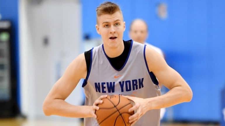 Knicks' Kristaps Porzingis running drills during the first day of...