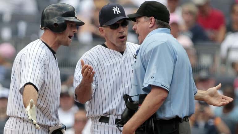 New York Yankees' Brett Gardner, left, and manager Joe Girardi,...
