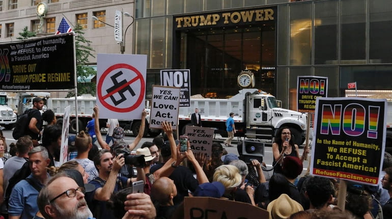 Demonstrators gather near Trump Tower in Manhattan to protest against...