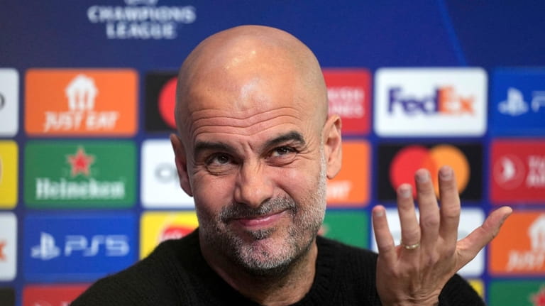 Manchester City manager Pep Guardiola speaks during a press conference...