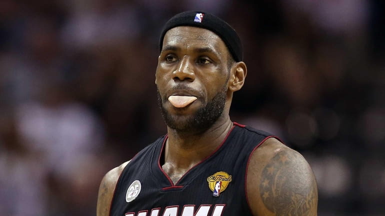 LeBron James of the Miami Heat reacts in the first...