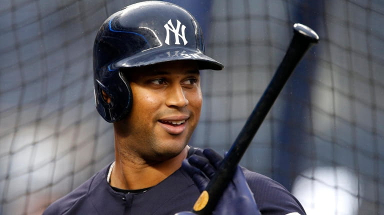 Aaron Hicks looks on during ALDS Game 3 batting practice...
