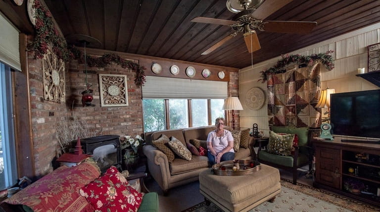 Susan Schilling sitting in the family room of her home...