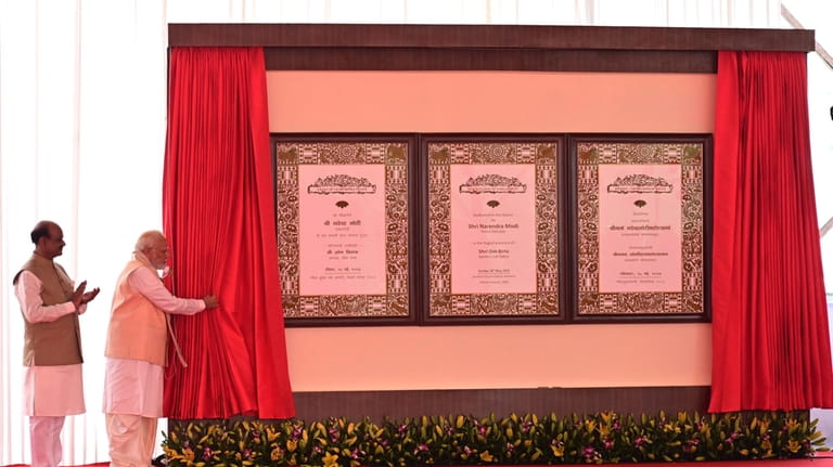 Indian prime minister Narendra Modi, second left, inaugurates the new...