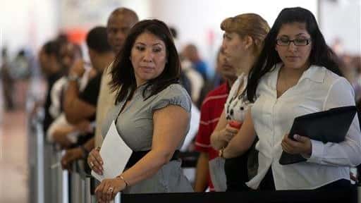 Norma Urbario, left, and America Rodriguez hold their resumes as...
