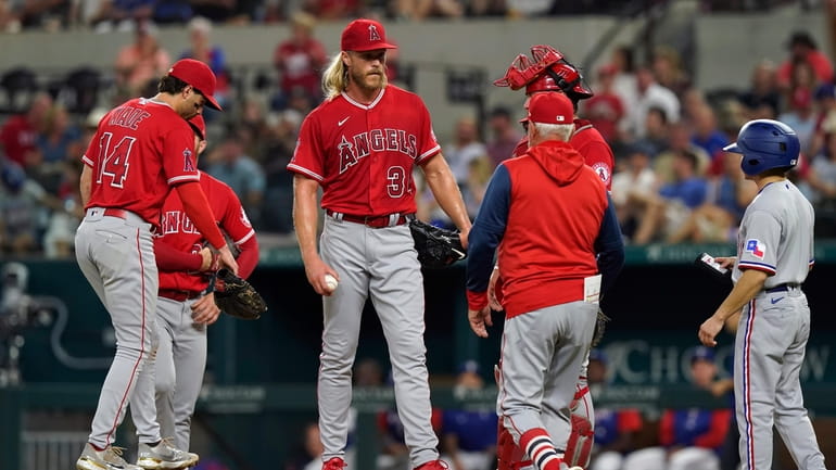 Los Angeles Angels starting pitcher Noah Syndergaard (34) stands on...