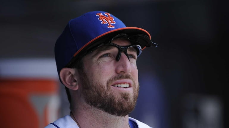 Ike Davis is seen in the dugout before a game...