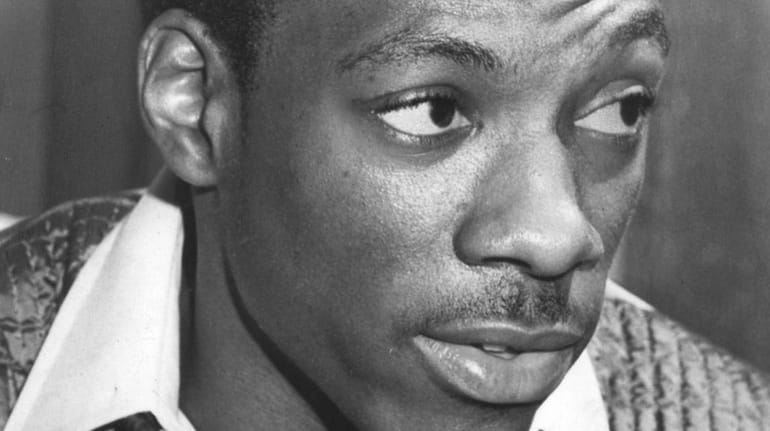Comedian Eddie Murphy poses at his mother's home in Roosevelt...