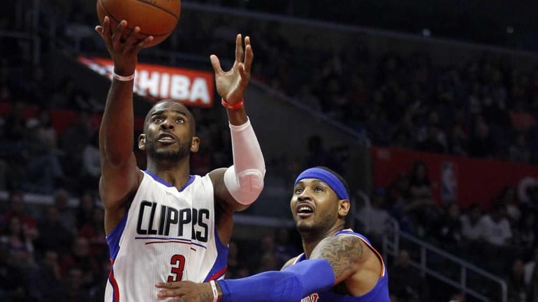 Los Angeles Clippers guard Chris Paul (3) gets past New...