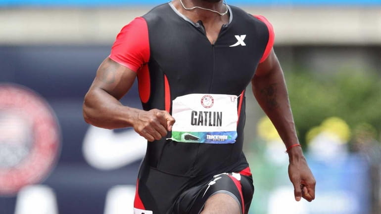 Justin Gatlin competes in the men's 100 meter dash semi...